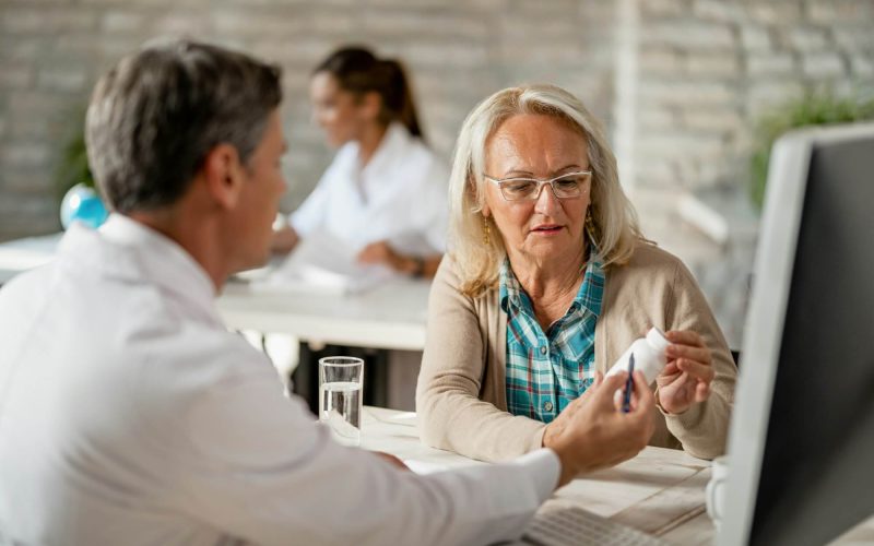 senior-woman-consulting-with-healthcare-worker-about-her-prescription-medicines-.jpg